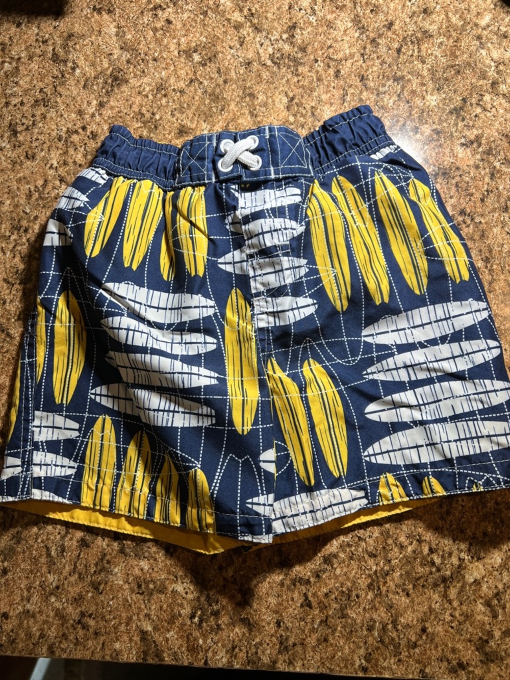 Circo Navy Swim Trunks with Yellow and White Surfboard Print